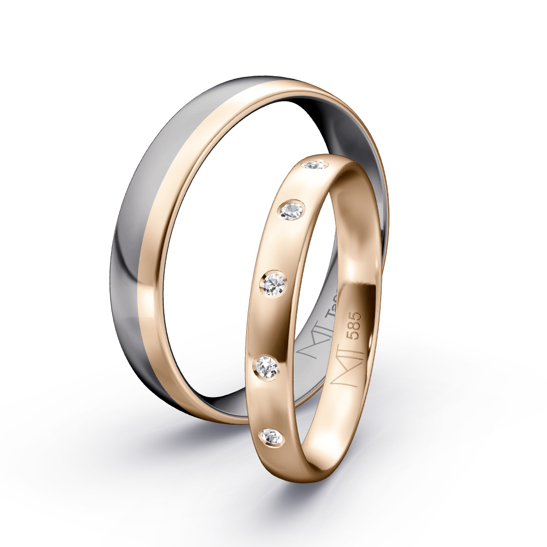 Trauringe aus Tantal mit Roségold-Inlay, moderner Herrenring und filigraner Damenring mit Brillanten auf hellem Hintergrund, edles zweifarbiges Design